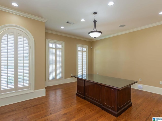 unfurnished office featuring dark wood-type flooring and crown molding