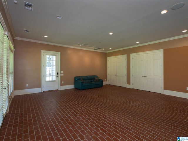 unfurnished living room featuring crown molding