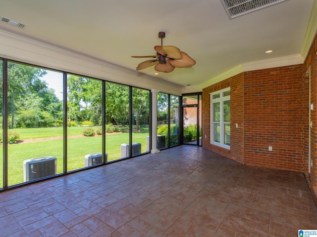 unfurnished sunroom with ceiling fan