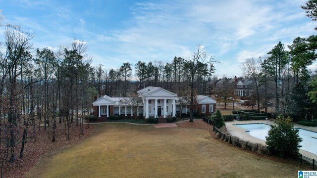 neoclassical / greek revival house with a front yard