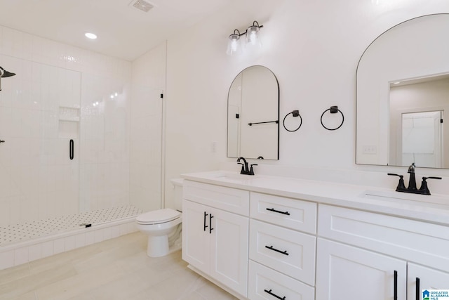 bathroom featuring vanity, toilet, and walk in shower