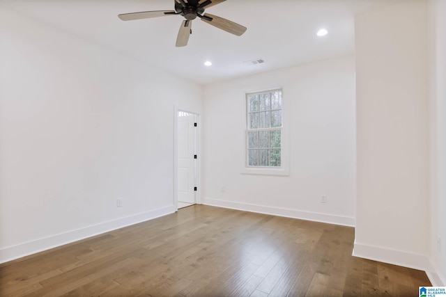 empty room featuring wood-type flooring and ceiling fan