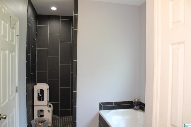 bathroom featuring recessed lighting and a garden tub