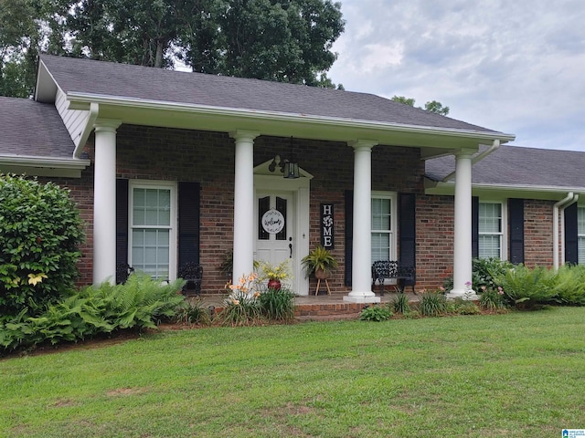 view of front of home with a front lawn and covered porch