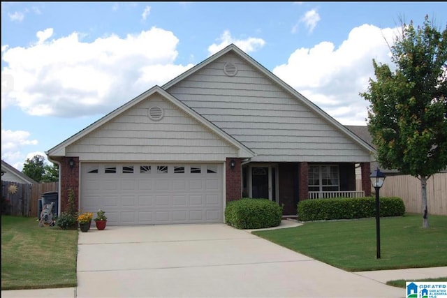 view of front of house featuring a garage and a front lawn