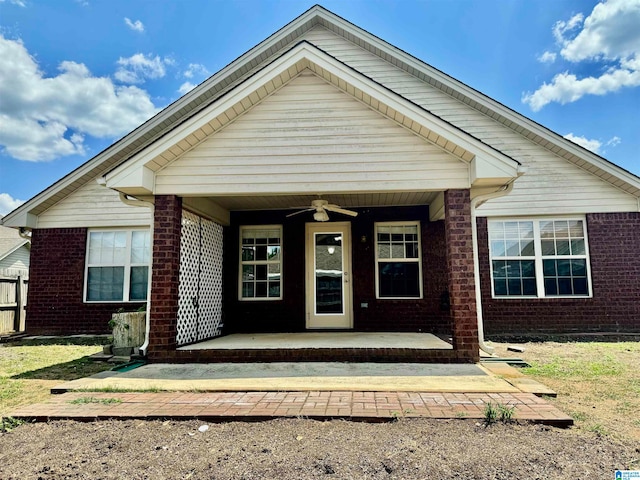 view of front of house with ceiling fan and a patio