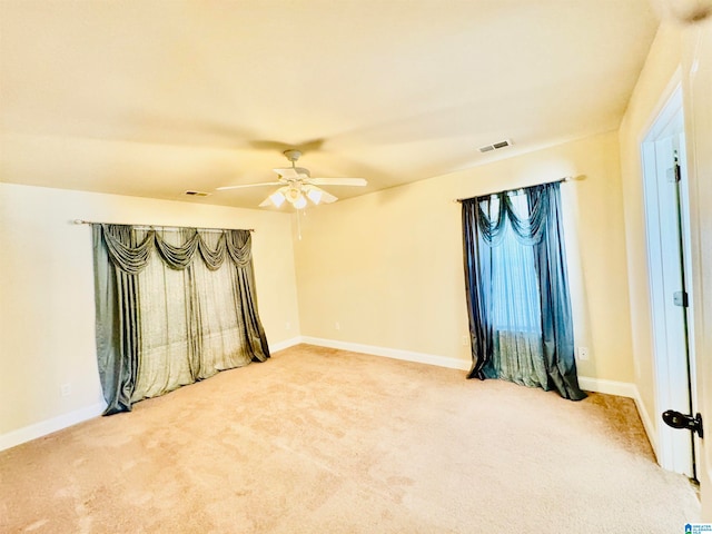 empty room with carpet and ceiling fan