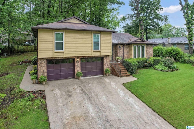 tri-level home featuring a front yard and a garage