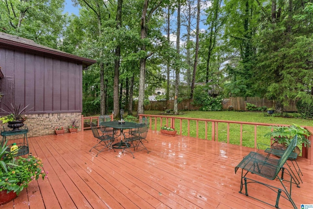 wooden terrace with a yard