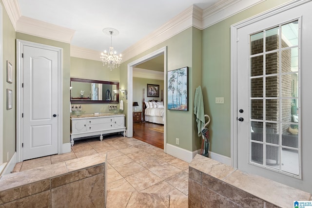 bathroom with vanity, crown molding, and a chandelier