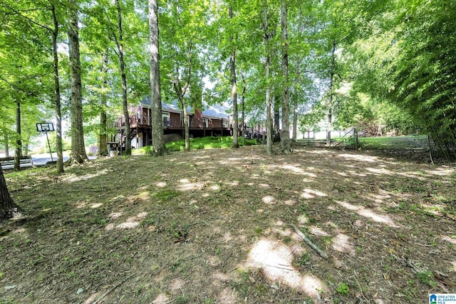 view of yard with a wooden deck