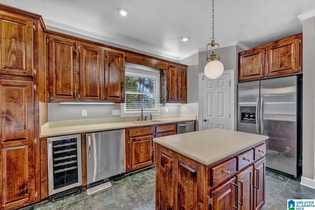 kitchen with sink, beverage cooler, hanging light fixtures, a center island, and stainless steel appliances