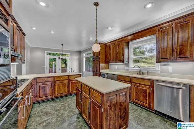 kitchen featuring a kitchen island, decorative light fixtures, dishwasher, sink, and gas cooktop