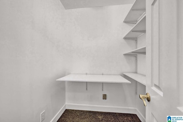 interior space featuring dark colored carpet