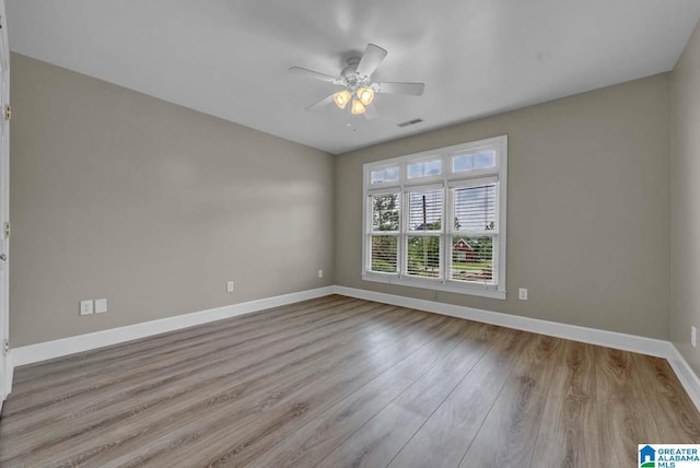 unfurnished room featuring ceiling fan and light wood-type flooring