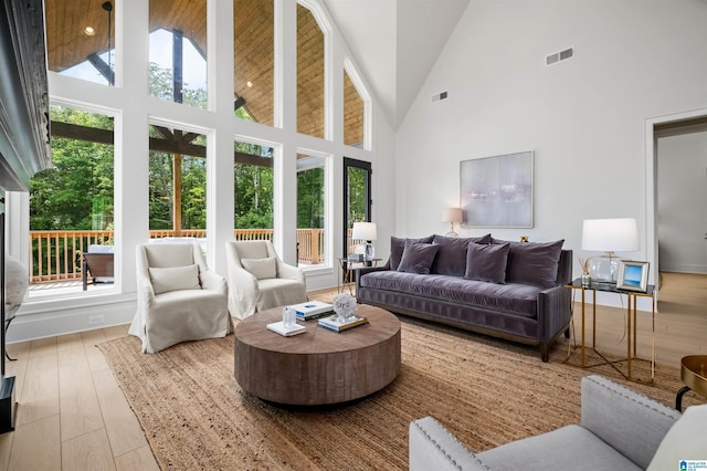 sunroom featuring vaulted ceiling