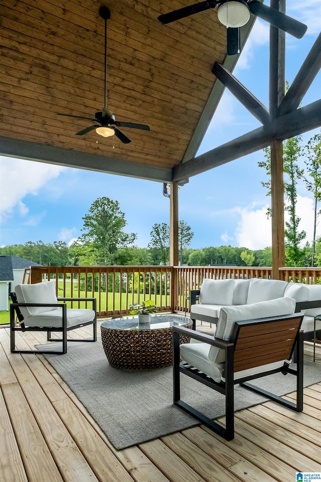 wooden terrace featuring an outdoor hangout area and ceiling fan