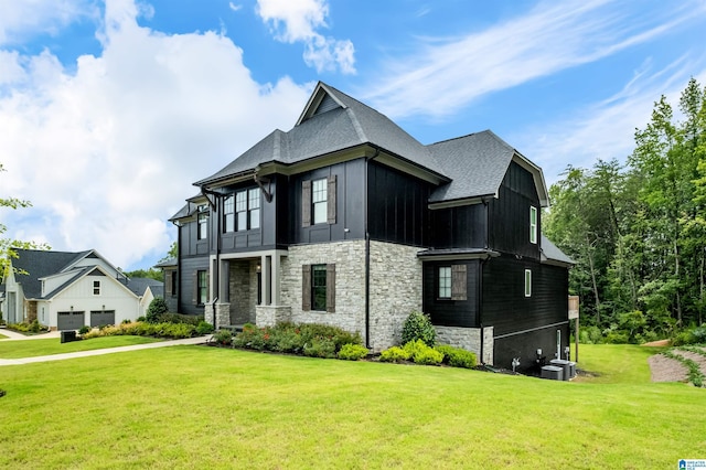 view of property exterior featuring a yard and central air condition unit