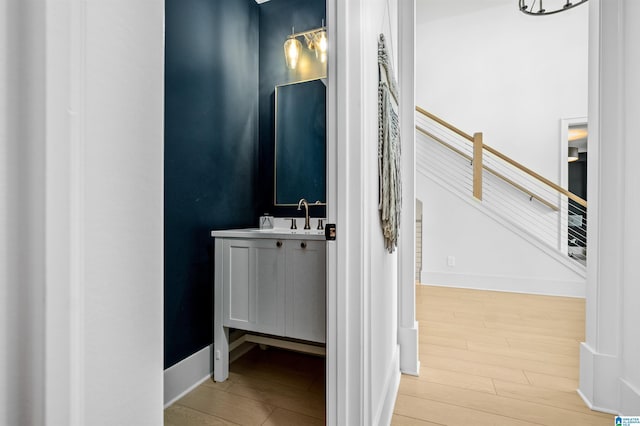 bathroom featuring hardwood / wood-style flooring and vanity