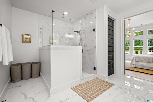 bathroom featuring walk in shower and a notable chandelier