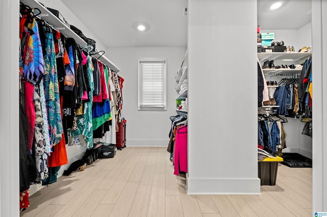 spacious closet featuring hardwood / wood-style flooring