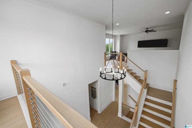 staircase with hardwood / wood-style flooring