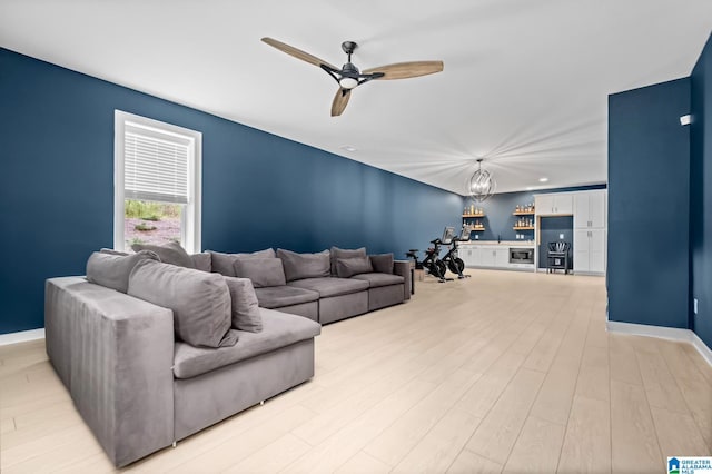 living room featuring ceiling fan and light wood-type flooring