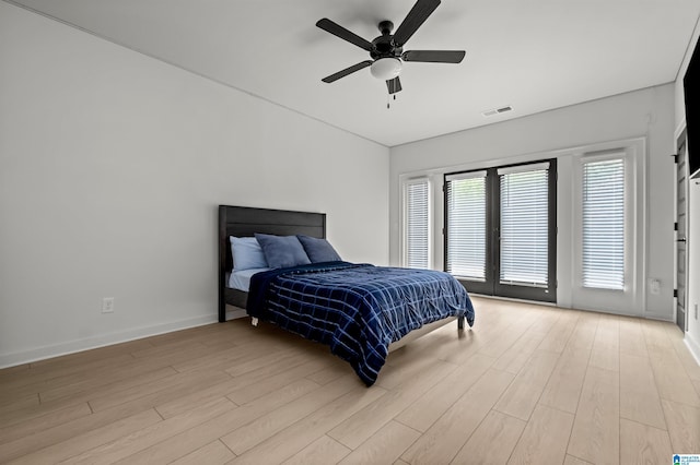 bedroom with access to exterior, ceiling fan, and light hardwood / wood-style flooring