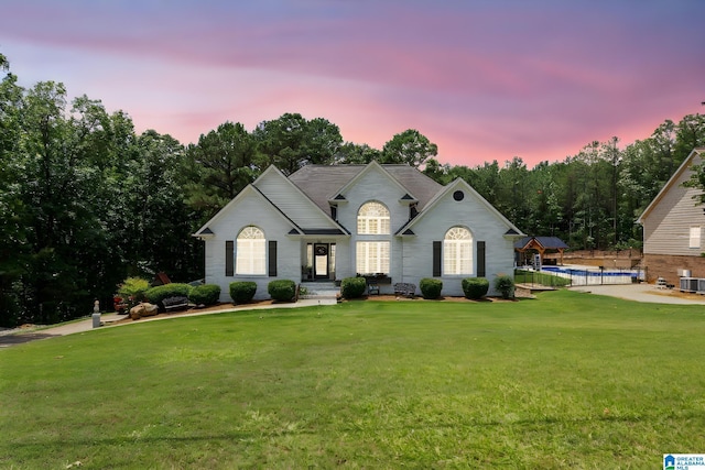 view of front of home with a lawn