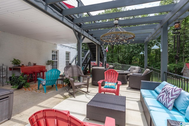 view of patio / terrace with an outdoor living space and a pergola