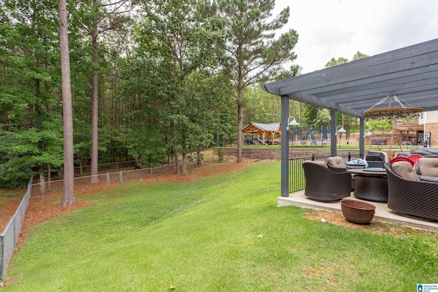 view of yard featuring a playground and a trampoline