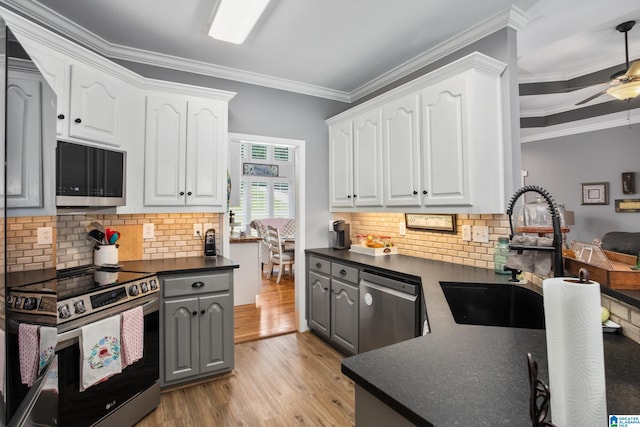 kitchen with stainless steel appliances and white cabinets