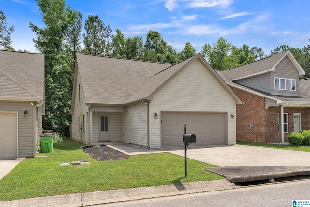 view of front of property with a garage and a front yard