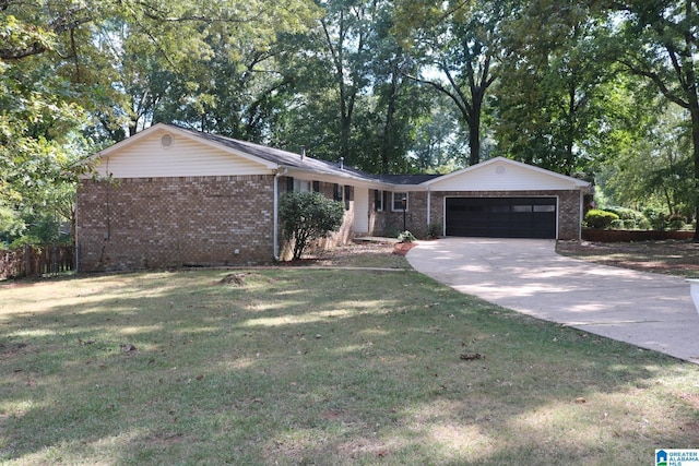 ranch-style house with a garage and a front lawn