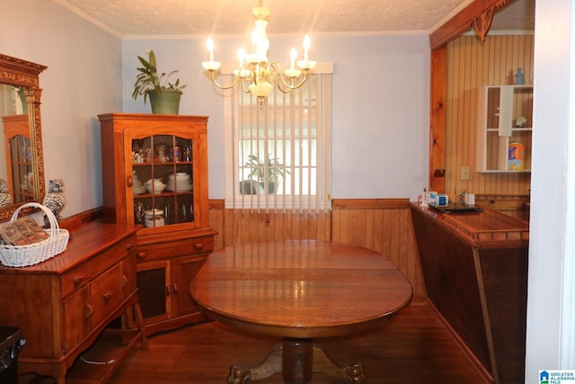 dining room with a chandelier, dark hardwood / wood-style flooring, breakfast area, and ornamental molding