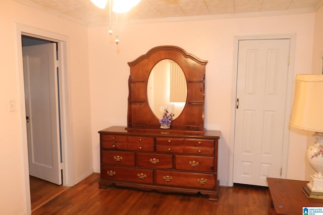 interior space featuring dark hardwood / wood-style floors and ornamental molding