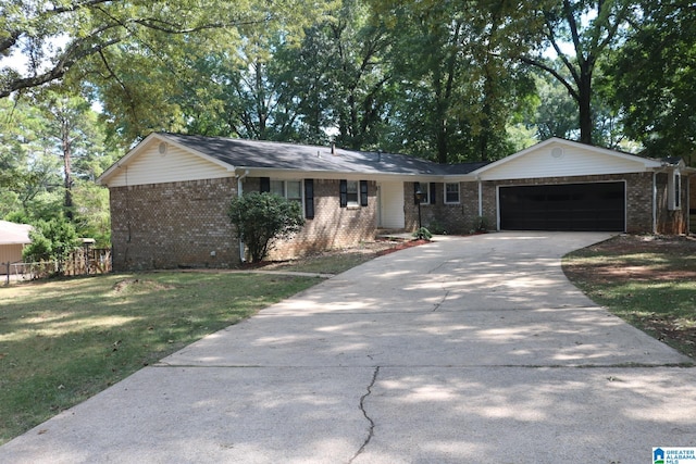 ranch-style home with a garage and a front lawn