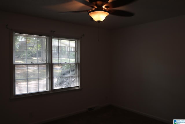 unfurnished room with ceiling fan