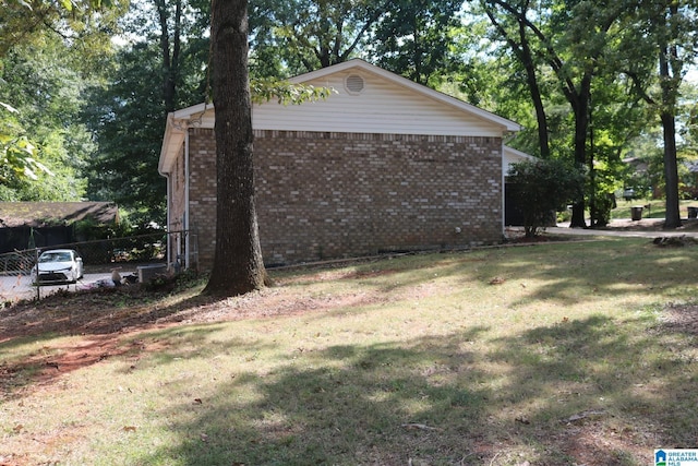 view of home's exterior featuring a lawn