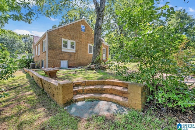 rear view of property with central air condition unit