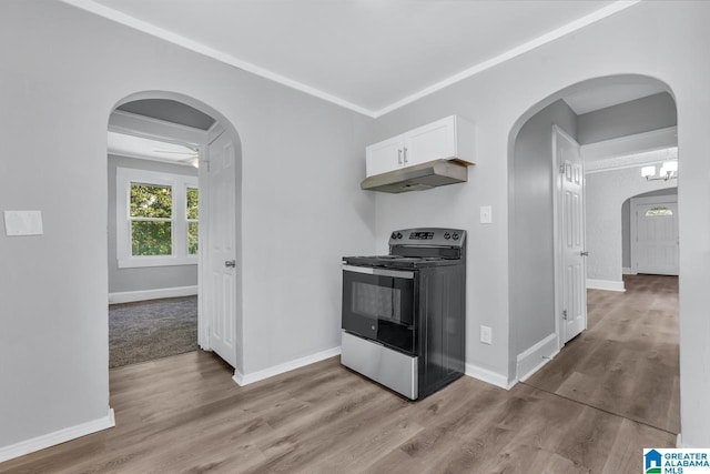 kitchen featuring white cabinets, electric range, light hardwood / wood-style floors, and crown molding