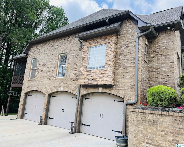 view of side of home with a garage