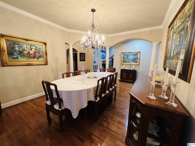 dining room featuring dark hardwood / wood-style floors, an inviting chandelier, and crown molding