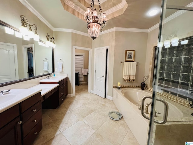 bathroom featuring vanity, tile patterned floors, crown molding, a notable chandelier, and a tub