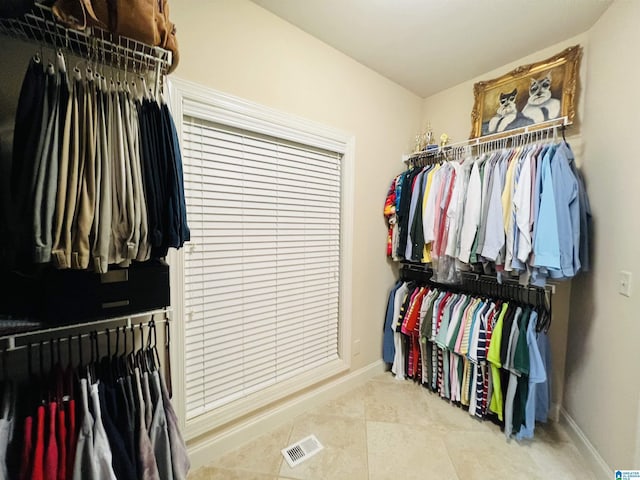 walk in closet featuring light tile patterned floors