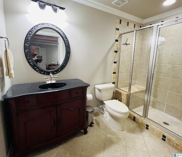 bathroom featuring tile patterned floors, vanity, an enclosed shower, and crown molding