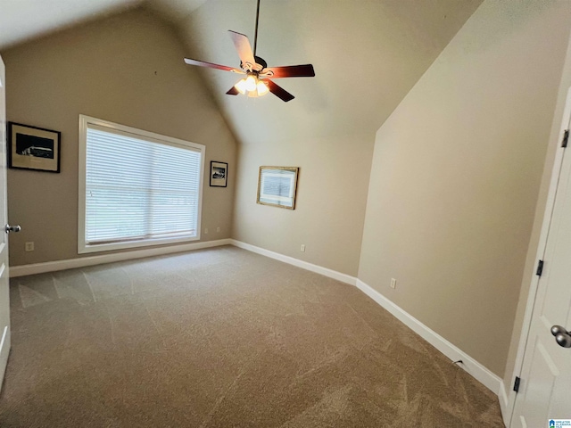 spare room with ceiling fan, carpet, and lofted ceiling