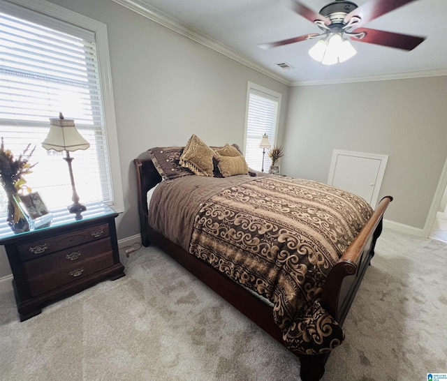 bedroom with multiple windows, ceiling fan, and crown molding