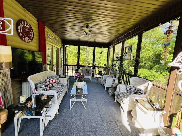 sunroom with a wealth of natural light and ceiling fan