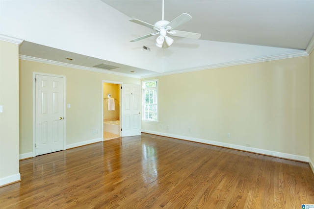 spare room with wood finished floors, a ceiling fan, visible vents, baseboards, and ornamental molding